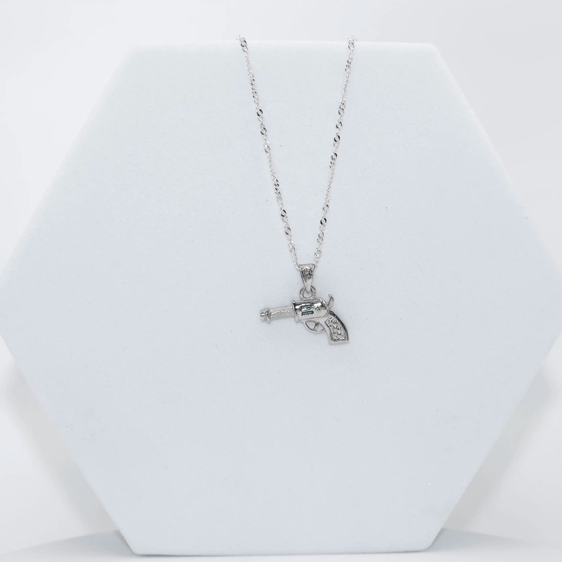 92.50 Silver Gun Shaped Pendent with chain